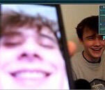 Wilbur holds his phone showing a close up selfie of himself